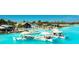 Stunning community pool features lounge area, swim up bar, and water activities at 8261 Ivy Stark Blvd, Wesley Chapel, FL 33545