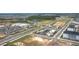 Aerial view of neighborhood and local retail area, featuring local amenities and retail spaces at 8261 Ivy Stark Blvd, Wesley Chapel, FL 33545