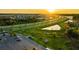 Aerial view of community dog park, with fenced areas and lovely sunset at 8261 Ivy Stark Blvd, Wesley Chapel, FL 33545