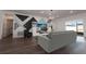Comfortable living room showcasing contemporary design, unique wall accents, and ample seating at 8261 Ivy Stark Blvd, Wesley Chapel, FL 33545