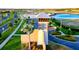 Community entrance sign with lush landscaping and view of lagoon in the distance at 8261 Ivy Stark Blvd, Wesley Chapel, FL 33545