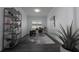 Home office featuring an modern shelving unit, contemporary desk, and decorative houseplant at 8261 Ivy Stark Blvd, Wesley Chapel, FL 33545