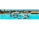 Expansive waterpark featuring slides, play structures, and an aqua-colored lagoon at 8261 Ivy Stark Blvd, Wesley Chapel, FL 33545
