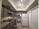 Well-lit kitchen with ample storage, white appliances, and practical layout at 865 Virginia Ct # 106, Dunedin, FL 34698