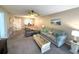 Open-concept living room that flows into dining area, and offers comfortable seating for relaxing and entertaining at 865 Virginia Ct # 106, Dunedin, FL 34698