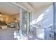 Relaxing patio with seating area is conveniently connected to indoor living space through sliding glass doors at 865 Virginia Ct # 106, Dunedin, FL 34698
