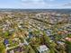 A high aerial shows the landscape, highlighting the property's location within a densely populated residential area at 8693 15Th N St, St Petersburg, FL 33702