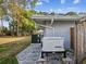Backyard featuring a home generator and air conditioning system at 8693 15Th N St, St Petersburg, FL 33702