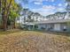 Expansive backyard perfect for outdoor activities and relaxation featuring a custom treehouse at 8693 15Th N St, St Petersburg, FL 33702