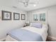 Bright bedroom featuring a comfortable bed, three decoratives, and natural light from the window at 8693 15Th N St, St Petersburg, FL 33702