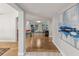 Hallway showcasing art, decorative wall features, and an open view into the comfortable living area at 8693 15Th N St, St Petersburg, FL 33702