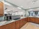 Modern kitchen featuring stainless steel appliances, granite countertops and a breakfast bar at 8693 15Th N St, St Petersburg, FL 33702