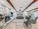 Cozy living room with stone fireplace and neutral-toned furniture at 8693 15Th N St, St Petersburg, FL 33702