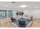 Cozy living room with stylish decor and sliding glass doors leading to an indoor pool area at 8693 15Th N St, St Petersburg, FL 33702