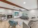 Inviting living room with fireplace, beamed ceilings, and comfortable seating at 8693 15Th N St, St Petersburg, FL 33702