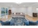 Inviting living room with comfortable seating, stylish decor, and direct access to the indoor pool area at 8693 15Th N St, St Petersburg, FL 33702