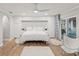 Bedroom featuring white furnishings, a ceiling fan, and sliding glass doors overlooking a pool at 8693 15Th N St, St Petersburg, FL 33702