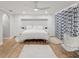 Bedroom featuring white furnishings, a ceiling fan, and a chair by a window at 8693 15Th N St, St Petersburg, FL 33702