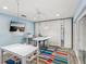 Well lit Office room with large desk and mirrored closets at 8693 15Th N St, St Petersburg, FL 33702