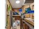Walk-in storage room features wood plank walls, overhead lighting, and metal storage shelves at 8693 15Th N St, St Petersburg, FL 33702