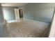 Inviting bedroom with neutral paint and large tiled flooring at 8728 N Mandarine Pl, Tampa, FL 33617