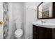 Bathroom with white marble-style tile, modern fixtures, and a vanity with a sink at 9031 Westchester Cir # 126, Tampa, FL 33604