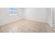 Well-lit bedroom features tile flooring, and a window at 9031 Westchester Cir # 126, Tampa, FL 33604