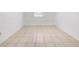Well-lit bedroom highlighting its tile floors, a window at 9031 Westchester Cir # 126, Tampa, FL 33604