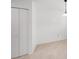 A bright space featuring tile floors, a closet, and a hanging light fixture at 9031 Westchester Cir # 126, Tampa, FL 33604