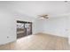 Bright living room with tile floors, ceiling fan and sliding glass doors that lead to a cozy balcony at 9031 Westchester Cir # 126, Tampa, FL 33604