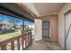 View of porch with railing and storage closet; great neighborhood views at 9031 Westchester Cir # 126, Tampa, FL 33604