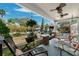 Inviting front porch with ceiling fans, comfortable seating, and decorative plants at 1015 E Caracas St, Tampa, FL 33603