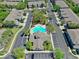 Overhead shot of community featuring clubhouse, pool, ample parking, and lush greenery at 10209 Spanish Breeze Ct, Riverview, FL 33578
