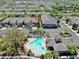 Aerial view of townhome community with pool, clubhouse, and mature trees at 10209 Spanish Breeze Ct, Riverview, FL 33578