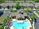 Aerial view of the community pool, clubhouse, and surrounding townhomes at 10209 Spanish Breeze Ct, Riverview, FL 33578
