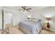 Spacious bedroom featuring a ceiling fan and neutral decor at 10209 Spanish Breeze Ct, Riverview, FL 33578