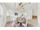 Charming dining area featuring a round table, neutral decor, and an elegant lighting fixture at 10209 Spanish Breeze Ct, Riverview, FL 33578