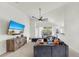 Spacious living room with a comfortable sofa, stylish decor, and access to a covered patio at 10209 Spanish Breeze Ct, Riverview, FL 33578