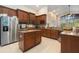 Well-equipped kitchen with stainless steel appliances and a central island, ready for cooking at 10623 Pearl Berry Loop, Land O Lakes, FL 34638