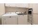 Convenient laundry room with side-by-side washer and dryer at 10623 Pearl Berry Loop, Land O Lakes, FL 34638
