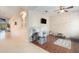 Bright playroom with a kitchen and a TV, creating a fun and engaging space for children at 10623 Pearl Berry Loop, Land O Lakes, FL 34638