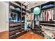 Well-organized walk-in closet with custom shelving, drawers, and ample storage space at 10623 Pearl Berry Loop, Land O Lakes, FL 34638