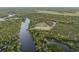 Stunning riverfront acreage, showcasing its desirable location, and lush greenery creates a tranquil retreat, perfect for relaxation and recreation at 1126 Oxbow Rd, Wimauma, FL 33598