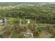 Aerial view of property with mature trees, large lot, and charming home, property lines shown at 1126 Oxbow Rd, Wimauma, FL 33598