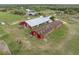 Farm view featuring barns, pasture, and mature trees at 1126 Oxbow Rd, Wimauma, FL 33598