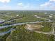 Beautiful riverfront property featuring a serene landscape, winding river, and private dock, ideal for a nature-filled escape at 1126 Oxbow Rd, Wimauma, FL 33598