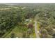 An amazing aerial view shows property with lush trees with the property line defined at 1126 Oxbow Rd, Wimauma, FL 33598