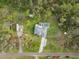 A beautiful homesite featuring an RV and boat is framed by lush trees and greenery at 1126 Oxbow Rd, Wimauma, FL 33598
