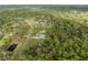 A picturesque aerial view of the neighborhood in a serene wooded setting at 1126 Oxbow Rd, Wimauma, FL 33598