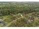 Aerial view of property with mature trees, large lot, and charming home, property lines shown at 1126 Oxbow Rd, Wimauma, FL 33598
